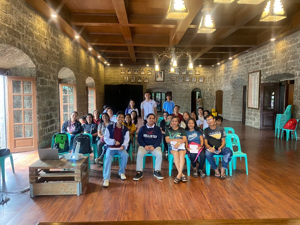 Participants and organizers of the DTI-Laguna seminar on Financial Literacy and Consumer Education for DSWD Sustainable Livelihood Program (SLP) beneficiaries pose for a group photo inside the event venue in Pagsanjan, Laguna.
