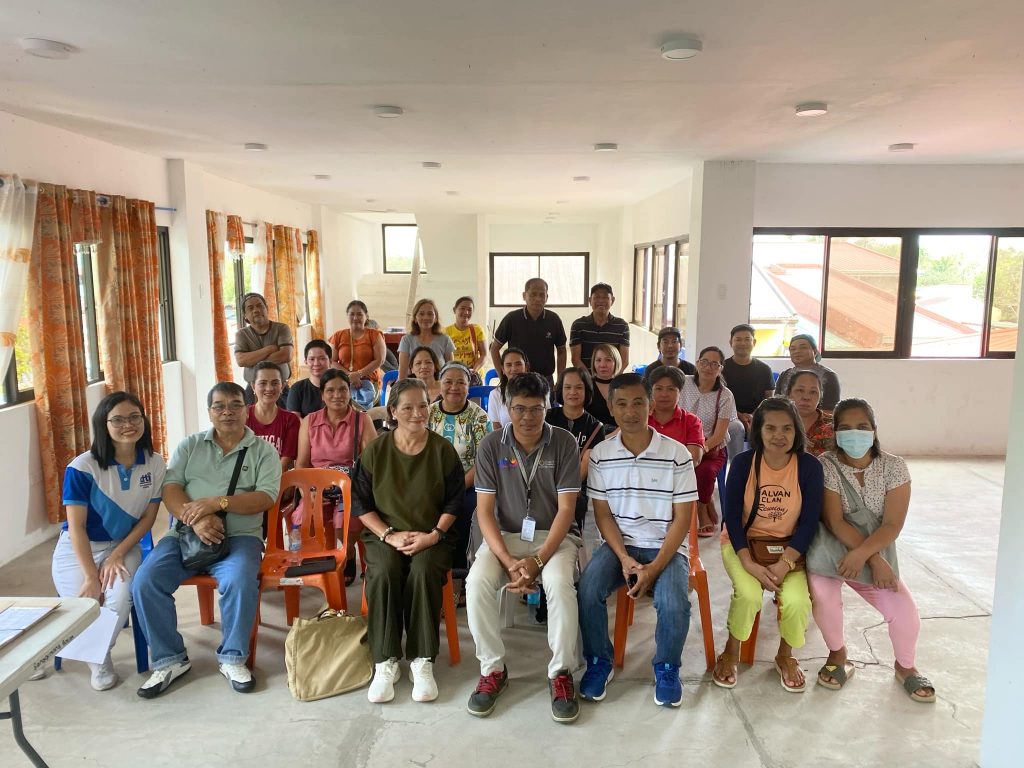 Group photo of Luisiana MSME participants and organizers attending the DTI-Laguna seminar on "Financial Opportunities for MSMEs: DTI-SBCorp Loan Programs & Consumer Education," posing inside the event venue in Luisiana, Laguna.