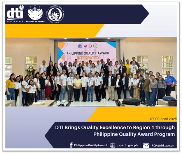 A group photograph shows approximately 55 individuals, identified as DTI PQA Secretariat, DTI Region 1 Representatives, and DMMMSU Officials and Participants, posing indoors in front of a screen displaying "PHILIPPINE QUALITY AWARD INTEGRATED". The group is diverse and includes both men and women of varying ages. They are standing on a slightly raised platform in what appears to be a conference or convention center. A Philippine flag stands to the left of the screen. The overall tone of the image is positive and celebratory, likely commemorating the Philippine Quality Award program training in Region 1.