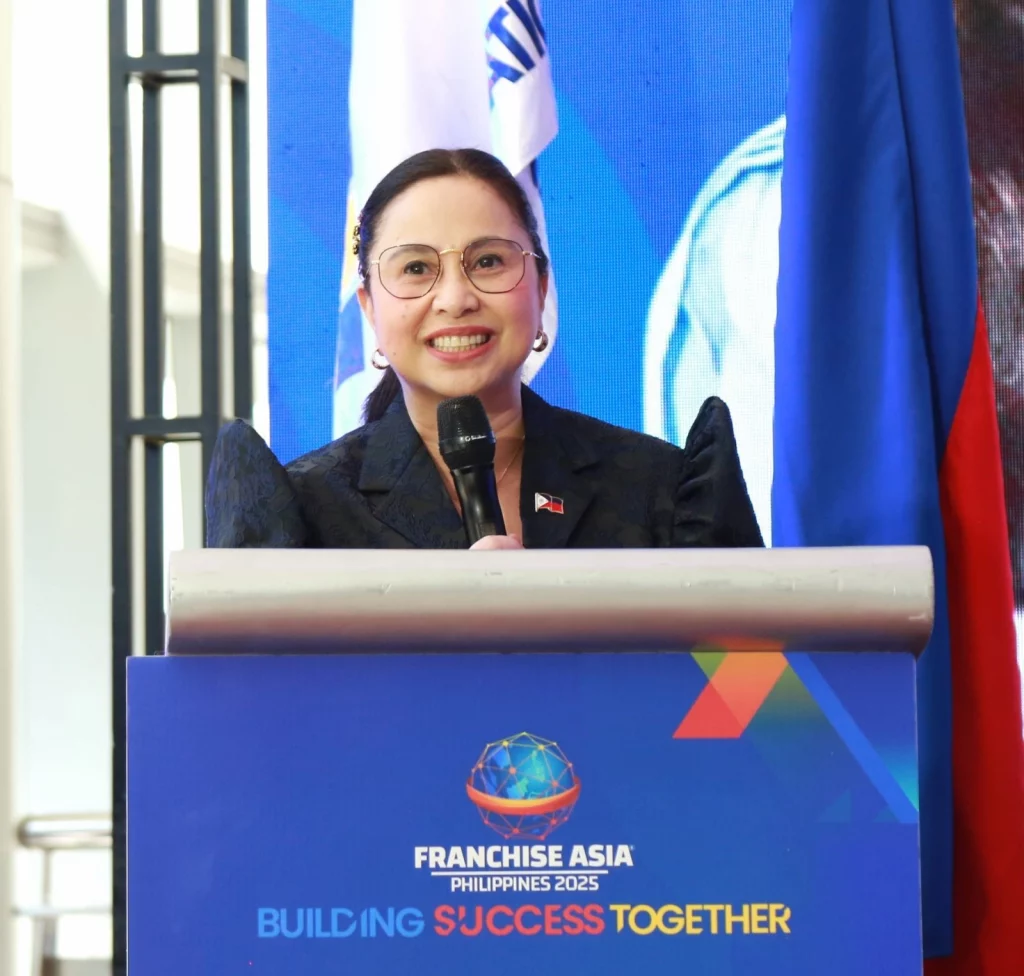 DTI Secretary Cristina Roque delivering a message of support during the opening of Franchise Asia Philippines 2025 at Pasay City.
