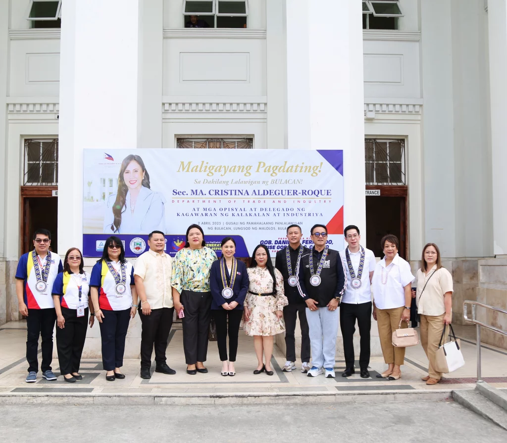 DTI Secretary Cristina Aldeguer-Roque poses for a group photo with DTI officials and delegates under a welcome banner during their visit to the Bulacan Provincial Government Building on April 2, as part of strengthening ties with the province.