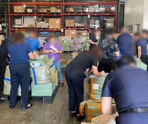 Confiscated illegal vape products displayed by the Department of Trade and Industry (DTI) in the Philippines, showing various colorful packaging and brands in violation of RA11900 regulations.