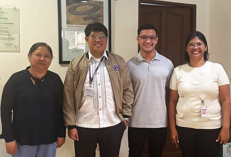 Group photo of PDCB and DPWH-NBCDO officials during their meeting on the National Building Code of the Philippines, featuring Engr. Jocelyn C. Carrasco, Atty. John Alexander S. Belderol, Engr. Renz Maverick E. Alcance, and Engr. Nikki C. Najarro