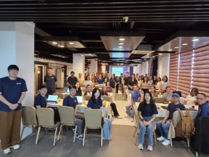 Participants attend the DTI and KTNET FTA Integrated Platform Roadshow at Hotel Marciano in Calamba City, seated around tables in a conference room with a presentation screen at the front, engaging in training on digital trade tools and Free Trade Agreements.