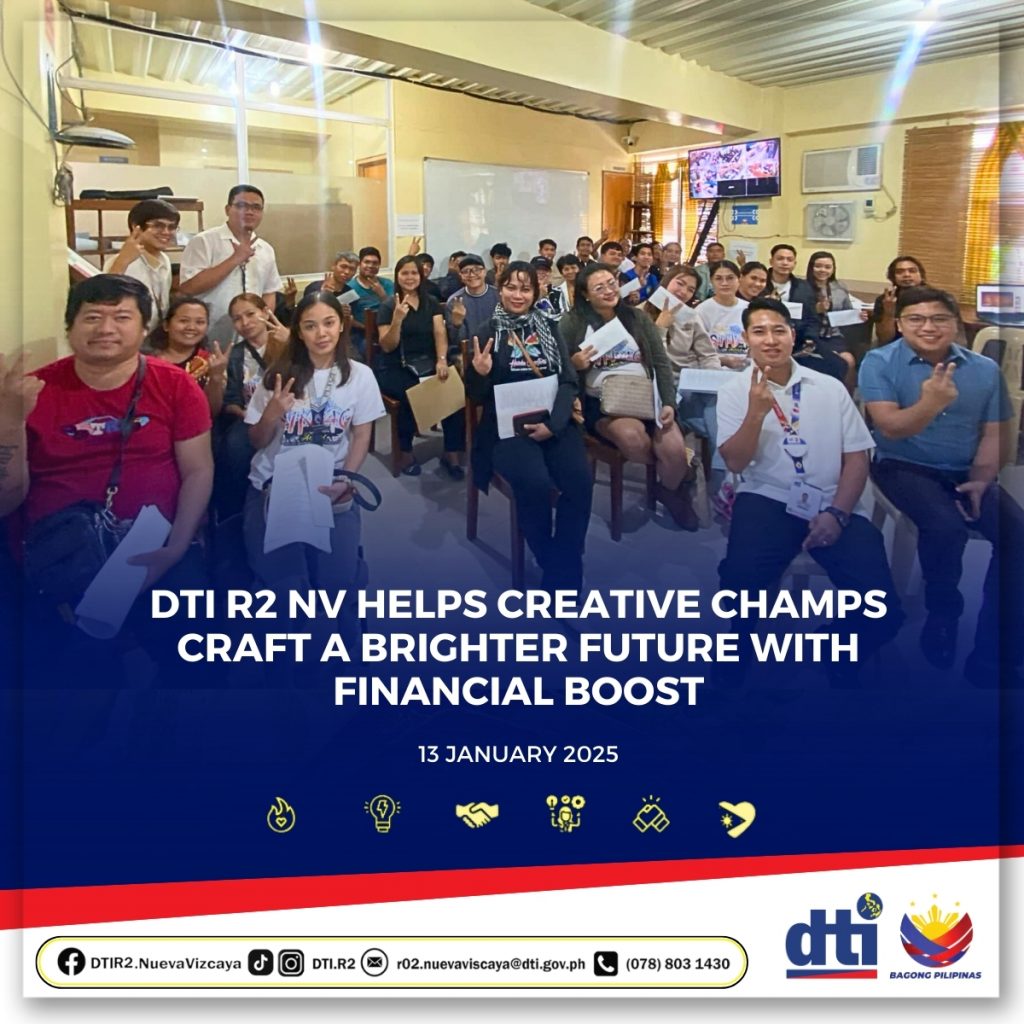 Creative industry MSME beneficiaries in Nueva Vizcaya sit together holding certificates during a financial assistance awarding event organized by DTI Region 2 on January 13, 2025, as part of post-typhoon recovery support.