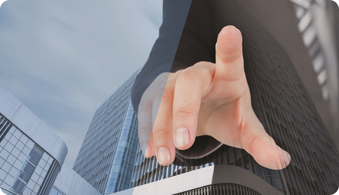 Hand with finger pointing towards a building Hand with finger pointing towards a building