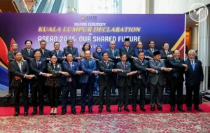 Group photo of ASEAN member-state representatives at the signing ceremony of the Kuala Lumpur Declaration on ASEAN 2045: Our Shared Future during the 46th ASEAN Summit. The representatives are standing in a line with arms crossed in front of a backdrop displaying the event's title.