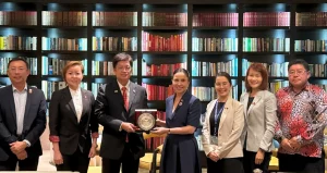 Philippine DTI Secretary Cristina A. Roque and SME Association of Malaysia President Dr. Chin Cee Seong hold a plaque during a meeting on the sidelines of the 46th ASEAN Summit in Kuala Lumpur, joined by key officials and representatives from both countries to strengthen SME cooperation.