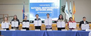 In photo: DTI Secretary Cristina A. Roque and DMW Secretary Hans Cacdac, together with representatives from DSWD, DOST, DOLE, DA, DOT, and TESDA, during the ceremonial signing of the Joint Memorandum Circular establishing the National Reintegration Network (NRN) for OFW reintegration.