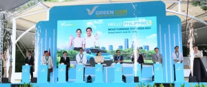 Green GSM's grand launch event in the Philippines, featuring the first fully foreign-owned electric vehicle operator, with officials on stage and a backdrop reading 'HELLO PHILIPPINES MOVE FORWARD THE GREEN WAY Grand Launch, June 10, 2023.'