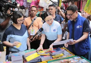 DTI Secretary Cristina Roque inspects school supplies in Divisoria ahead of school opening to ensure affordability and compliance with suggested retail prices.