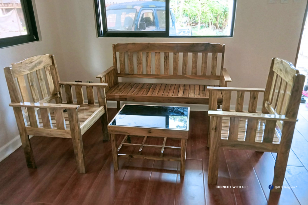 A handcrafted wooden sala set by Suyman Furniture displayed in a bright, homey interior—showcasing the quality and craftsmanship that turned a backyard dream into a thriving family business in Bohol, supported by DTI Region 7. A handcrafted wooden sala set by Suyman Furniture displayed in a bright, homey interior—showcasing the quality and craftsmanship that turned a backyard dream into a thriving family business in Bohol, supported by DTI Region 7.