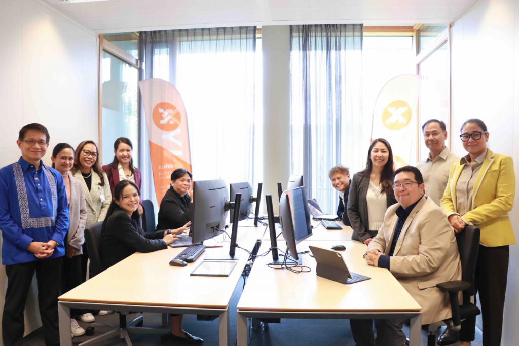 A group picture with key attendees at Xinyx’s office.