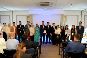 P&G leadership team, DTI officials, and QBO Innovation partners pose on stage during the vGROW Program event, celebrating startup collaboration and innovation in the Philippines.